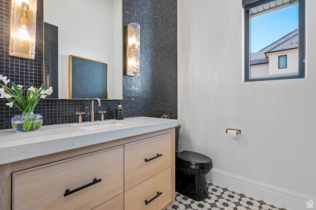 3905 S Quarry Ridge Dr, St George, UT 84790 - bathroom featuring vanity, decorative backsplash, and toilet