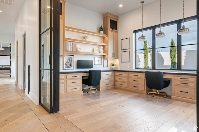 3905 S Quarry Ridge Dr, St George, UT 84790 - unfurnished office with built in desk and light hardwood / wood-style flooring