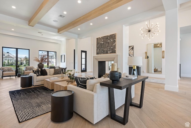 3905 S Quarry Ridge Dr, St George, UT 84790 - living room featuring ornate columns, an inviting chandelier, a high ceiling, beam ceiling, and light wood-type flooring