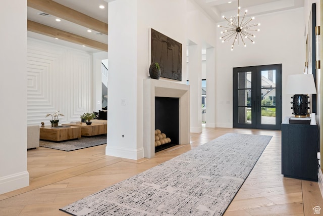 3905 S Quarry Ridge Dr, St George, UT 84790 - foyer with beamed ceiling, a towering ceiling, light hardwood / wood-style flooring, and a notable chandelier