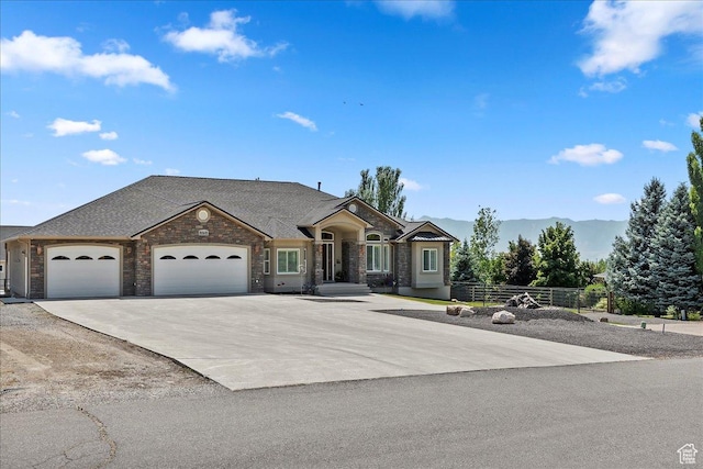 898 E 260 N, Hyde Park, UT 84318 - view of front of house with a mountain view and a garage