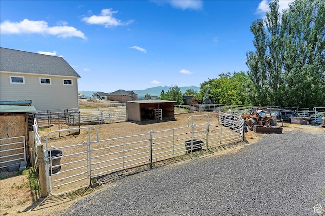 898 E 260 N, Hyde Park, UT 84318 - view of yard featuring a mountain view, an outbuilding, and a rural view