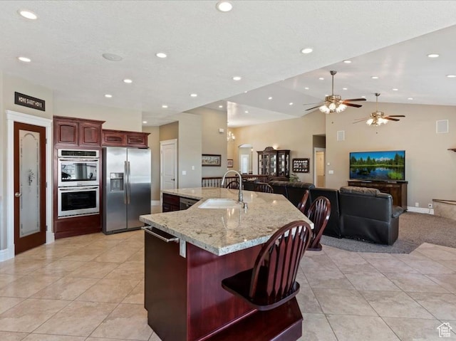 898 E 260 N, Hyde Park, UT 84318 - kitchen with stainless steel appliances, ceiling fan, a spacious island, sink, and light tile patterned floors