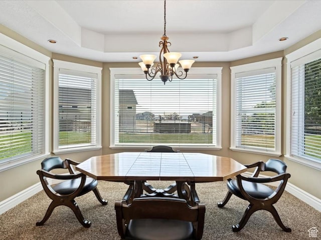 898 E 260 N, Hyde Park, UT 84318 - dining room featuring a healthy amount of sunlight, a tray ceiling, and a chandelier