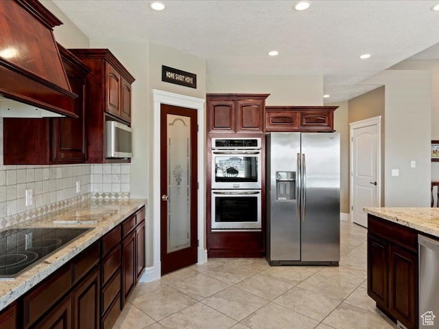 898 E 260 N, Hyde Park, UT 84318 - kitchen with backsplash, custom exhaust hood, light tile patterned floors, and stainless steel appliances
