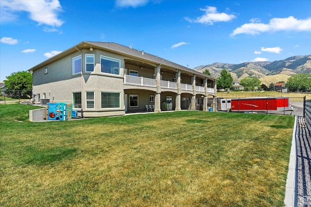 898 E 260 N, Hyde Park, UT 84318 - back of house with a mountain view and a yard