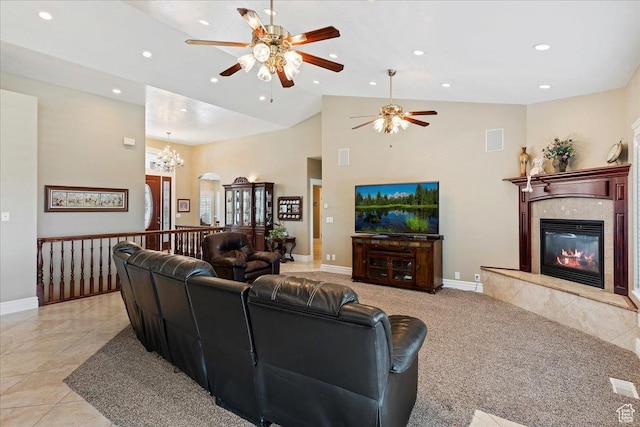 898 E 260 N, Hyde Park, UT 84318 - living room with a high end fireplace, light tile patterned floors, ceiling fan with notable chandelier, and lofted ceiling