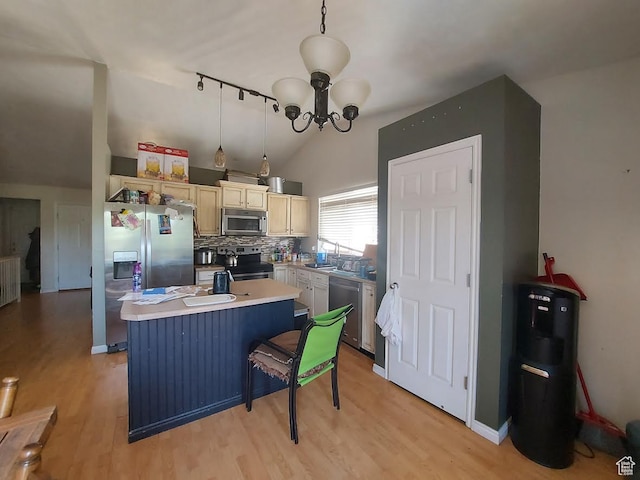 8497 S 6465 W, West Jordan, UT 84081 - kitchen featuring light wood-type flooring, an inviting chandelier, a center island, stainless steel appliances, and hanging light fixtures