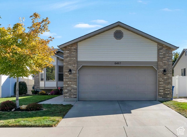single story home with a front lawn