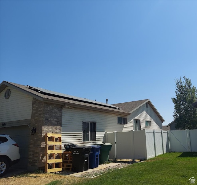8497 S 6465 W, West Jordan, UT 84081 - rear view of property with a yard
