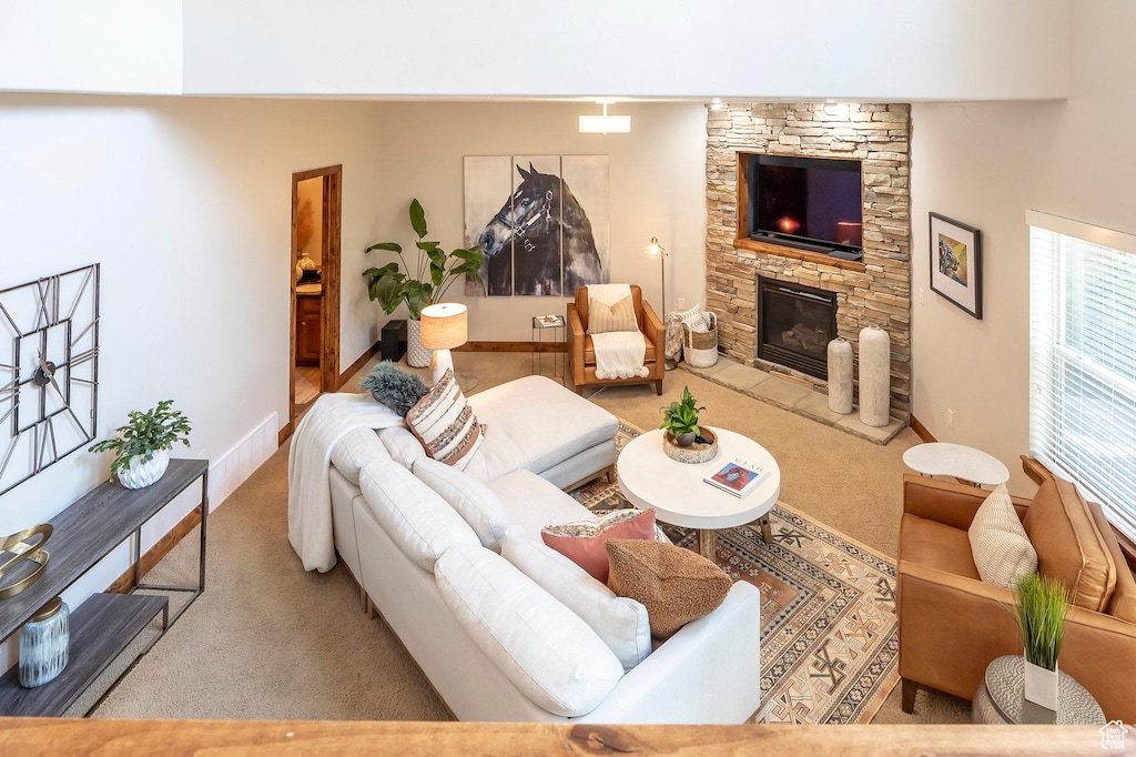 1115 N 455 W Unit 7, Midway, UT 84049 - living room featuring carpet flooring, a stone fireplace, and baseboards