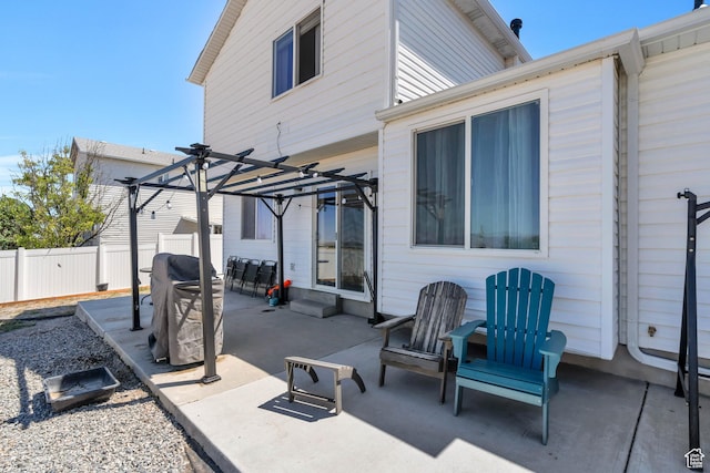 view of patio with a grill and a pergola