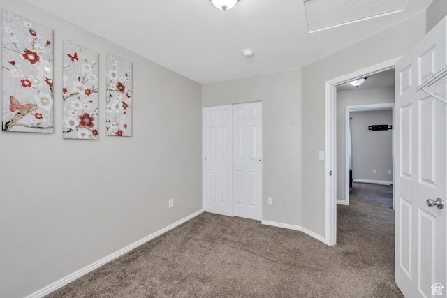 unfurnished bedroom featuring a closet and carpet flooring
