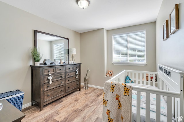 bedroom featuring light wood-type flooring