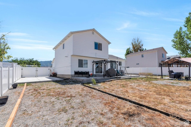rear view of property with a gazebo, a patio, and a pergola