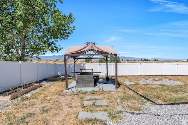 view of yard with a gazebo and a mountain view