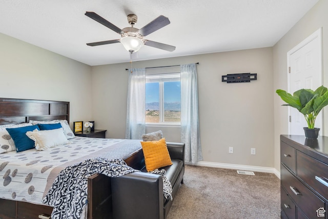 bedroom featuring light colored carpet and ceiling fan