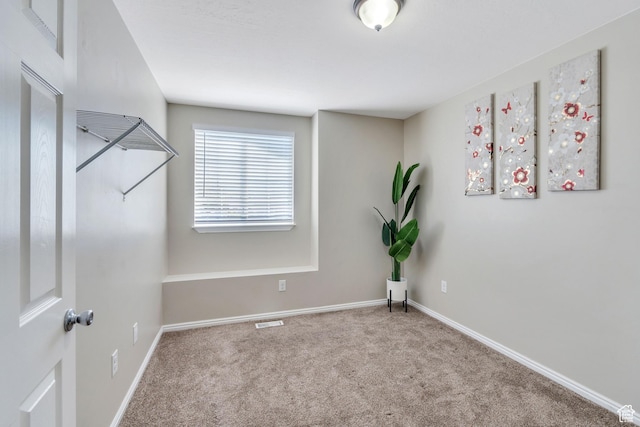 spare room with carpet floors
