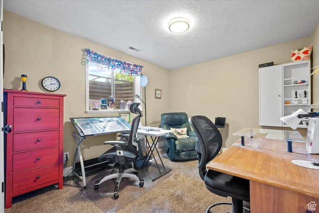 carpeted office space with visible vents and a textured ceiling
