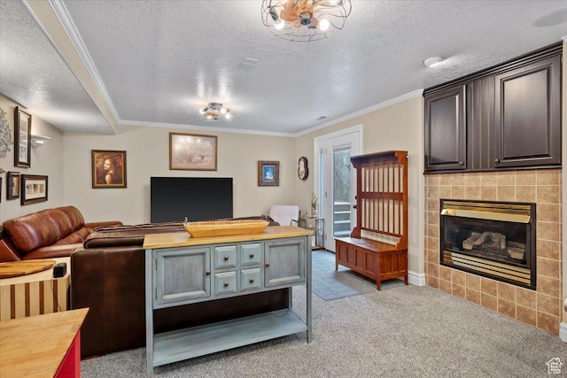 living room featuring a textured ceiling, crown molding, light colored carpet, and a tile fireplace