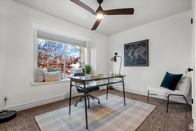 office space featuring baseboards, carpet, and a ceiling fan