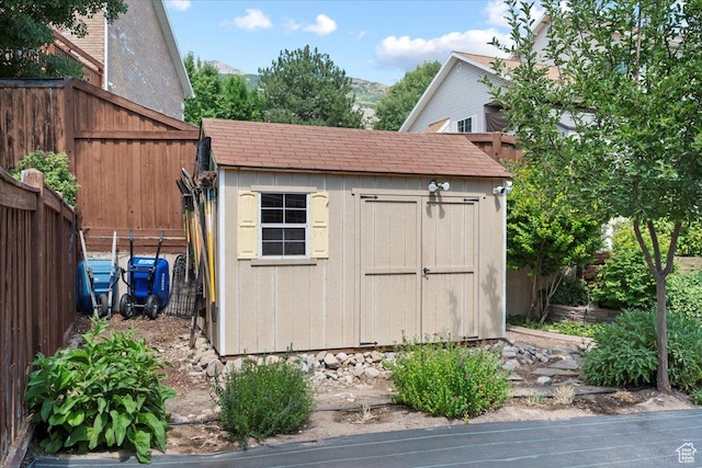 view of shed featuring a fenced backyard