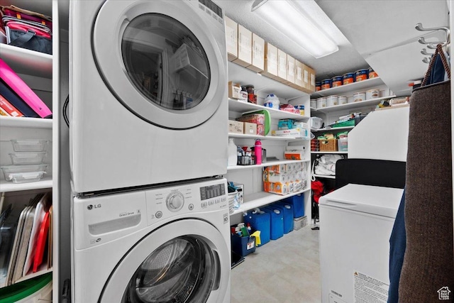 laundry room with laundry area and stacked washing maching and dryer
