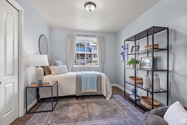 carpeted bedroom with baseboards
