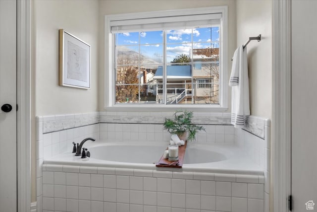 full bathroom featuring plenty of natural light and a garden tub
