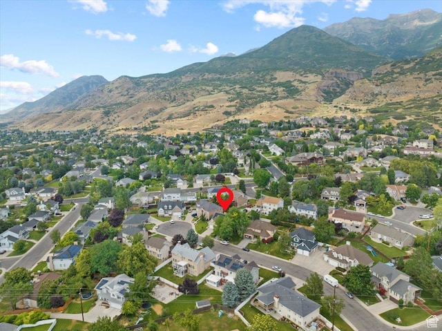 birds eye view of property with a residential view and a mountain view
