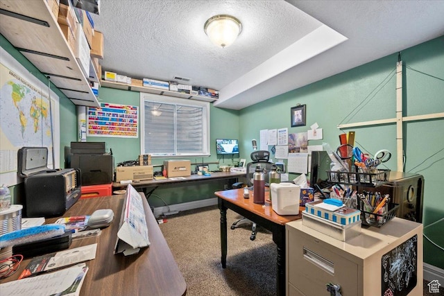 office area with carpet flooring and a textured ceiling