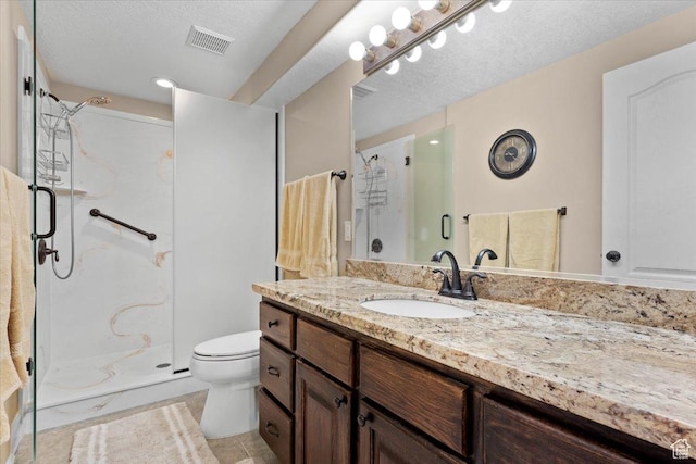 full bath featuring visible vents, toilet, a shower stall, and a textured ceiling
