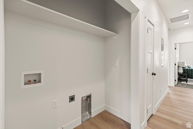 washroom featuring wood finished floors, hookup for an electric dryer, laundry area, visible vents, and hookup for a washing machine
