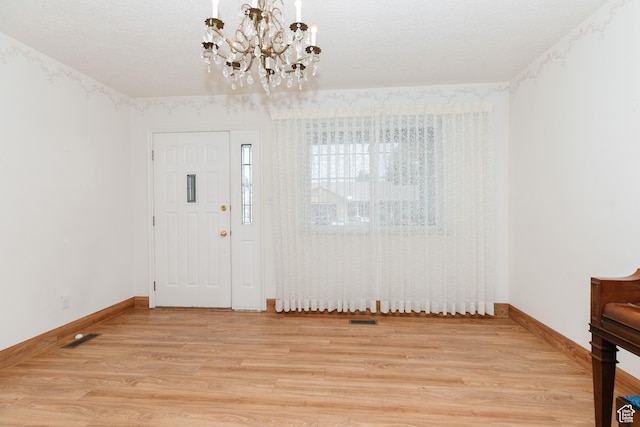 596 Eagle Dr, Preston, ID 83263 - entryway featuring hardwood / wood-style floors and a notable chandelier