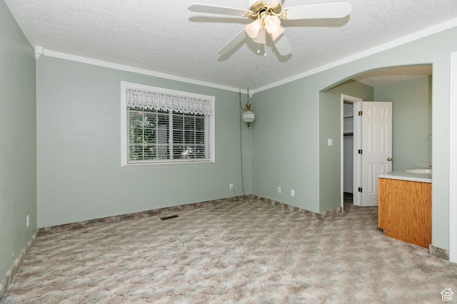 596 Eagle Dr, Preston, ID 83263 - carpeted spare room with ceiling fan, crown molding, and a textured ceiling