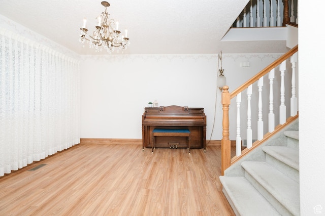 596 Eagle Dr, Preston, ID 83263 - interior space featuring wood-type flooring and an inviting chandelier