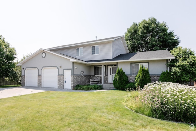 596 Eagle Dr, Preston, ID 83263 - view of property with a porch, a garage, and a front yard