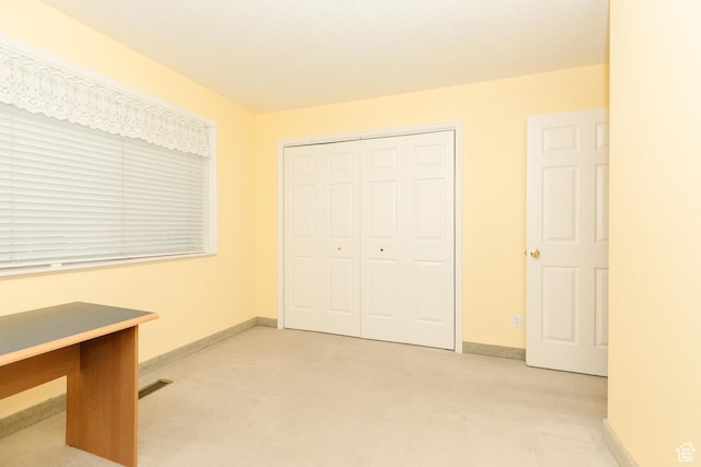 596 Eagle Dr, Preston, ID 83263 - unfurnished bedroom featuring light carpet and a closet