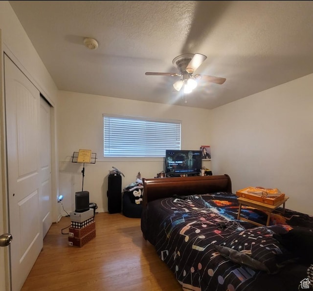 246 E Helm Ave S Unit 26, South Salt Lake, UT 84115 - bedroom with wood finished floors, a closet, and ceiling fan