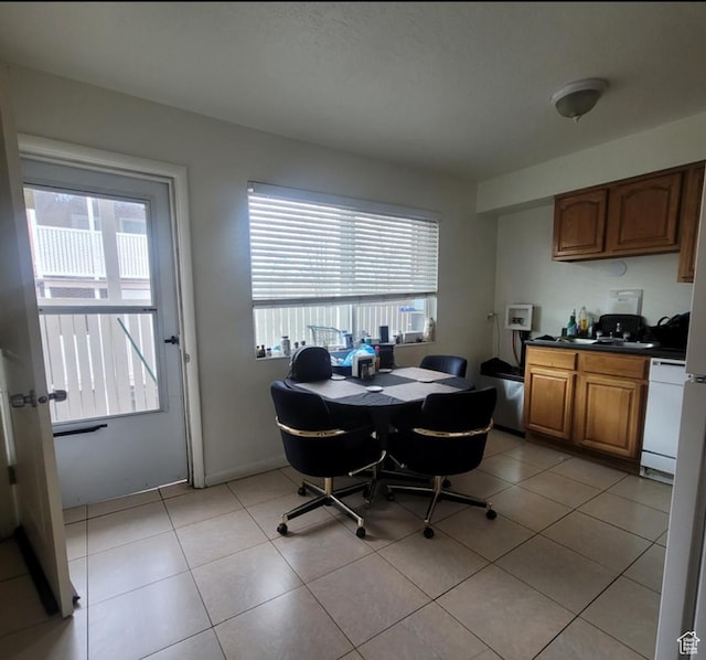 246 E Helm Ave S Unit 26, South Salt Lake, UT 84115 - dining area featuring light tile patterned floors and a desk