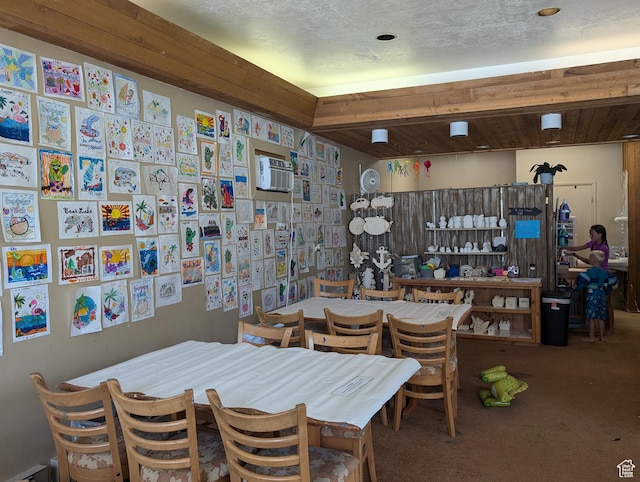 2176 S Bear Lake Blvd S Unit 452, Garden City, UT 84028 - carpeted dining area featuring a textured ceiling and a wall mounted air conditioner