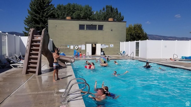 2176 S Bear Lake Blvd S Unit 452, Garden City, UT 84028 - community pool with fence, a patio, and a mountain view