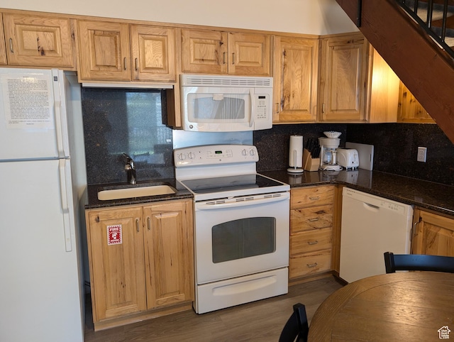 2176 S Bear Lake Blvd S Unit 452, Garden City, UT 84028 - kitchen with white appliances, a sink, dark wood-style floors, dark stone counters, and tasteful backsplash