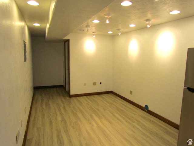 6528 S Rogers Dr, West Valley City, UT 84118 - basement with hardwood / wood-style flooring and refrigerator