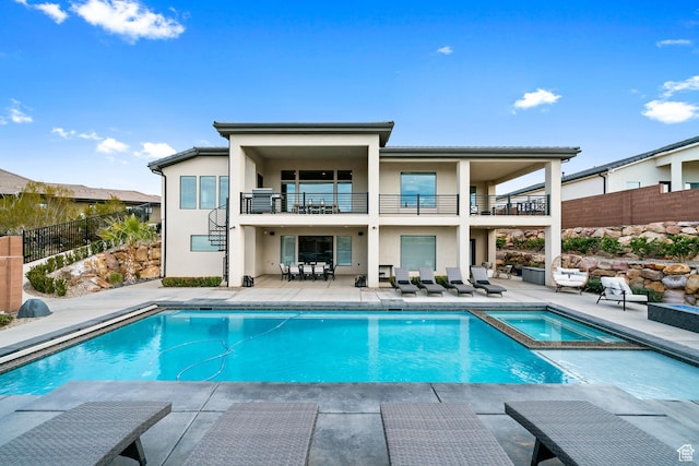 6026 S Zen Trail Way, St George, UT 84790 - rear view of house featuring a balcony, a pool with hot tub, and a patio