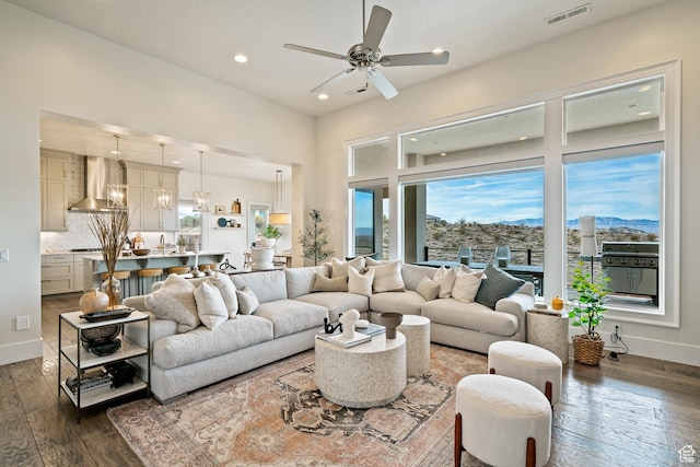 6026 S Zen Trail Way, St George, UT 84790 - living room featuring dark hardwood / wood-style flooring, a mountain view, and ceiling fan with notable chandelier