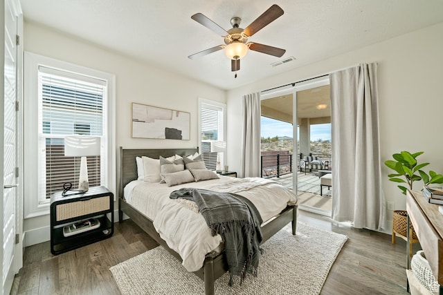 6026 S Zen Trail Way, St George, UT 84790 - bedroom featuring dark hardwood / wood-style flooring, access to exterior, and ceiling fan