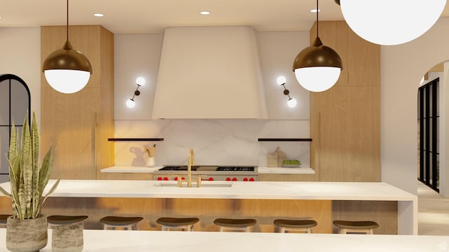1272 N Hillside Way, Santa Clara, UT 84765 - kitchen featuring wall chimney exhaust hood, decorative backsplash, a kitchen bar, and hanging light fixtures