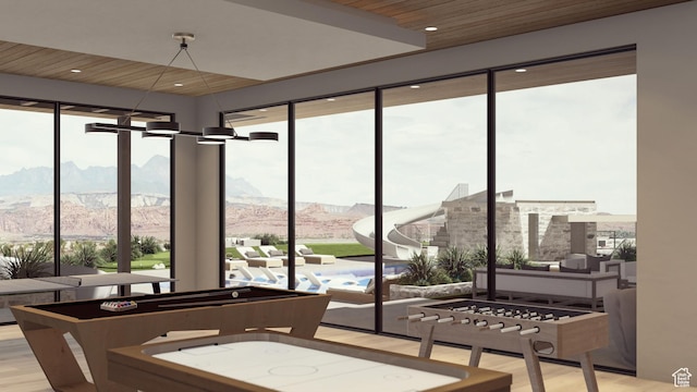 1272 N Hillside Way, Santa Clara, UT 84765 - rec room with a mountain view, a wealth of natural light, and light hardwood / wood-style flooring