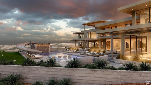 1272 N Hillside Way, Santa Clara, UT 84765 - pool at dusk with a water slide and a patio area